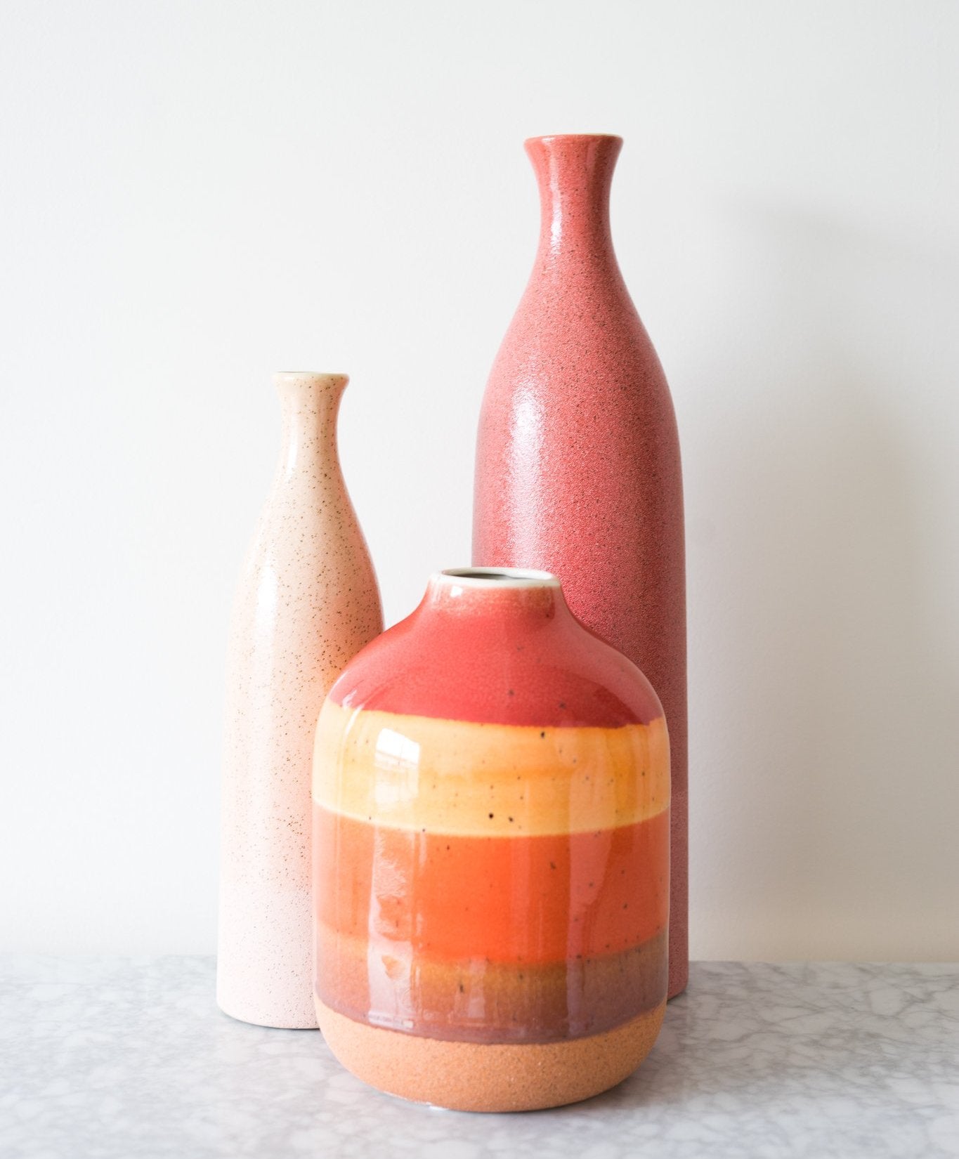  this Color Stripe Ceramic Vase, which has a dynamic colour glazed smooth finish to light up a room.