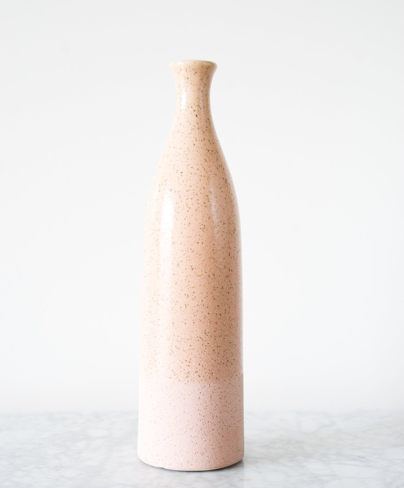 our Dual Texture Ceramic Vase has a smooth color glazed upper body and a matte glazed lower body.