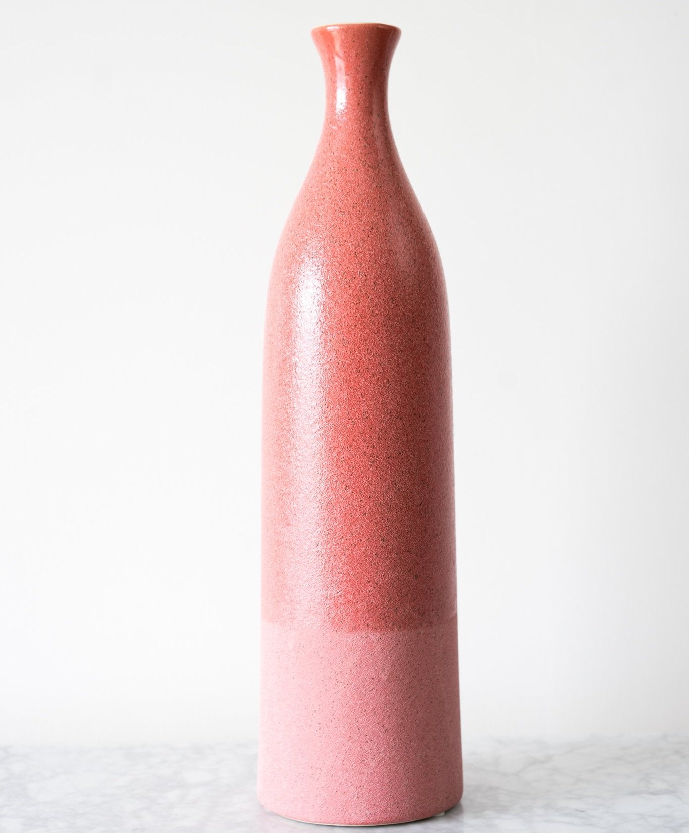 our Dual Texture Ceramic Vase has a smooth color glazed upper body and a matte glazed lower body.